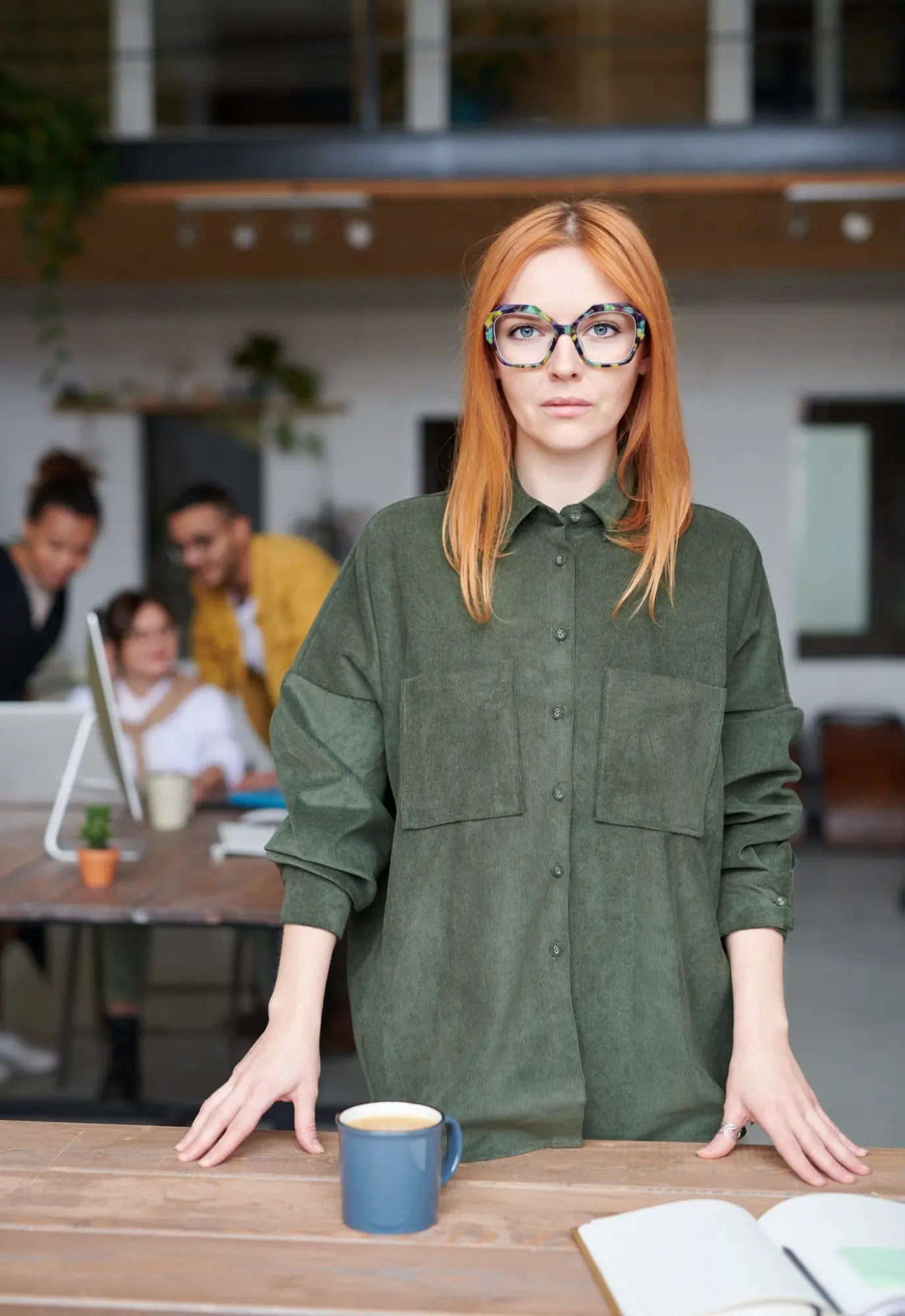 Professional office setting with model wearing Forest Marble eyeglasses, showing confident everyday style.